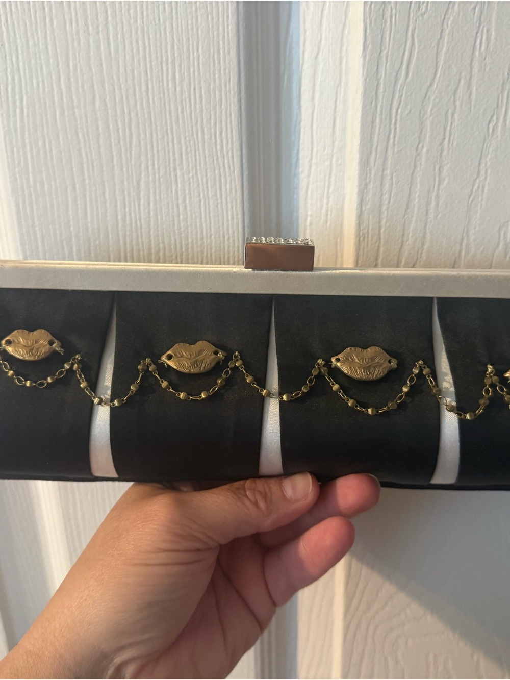 Elegant Black and Cream Lip-Accent Chain Clutch